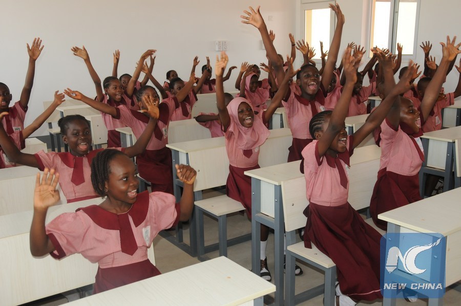 Students cheer in a new classroom at the China-Assisted Model Primary School in Abuja Image Above: Students cheer in a new classroom at the China-Assisted Model Primary School in Abuja, Nigeria, July 6, 2018. (Xinhua/Zhang Baoping)